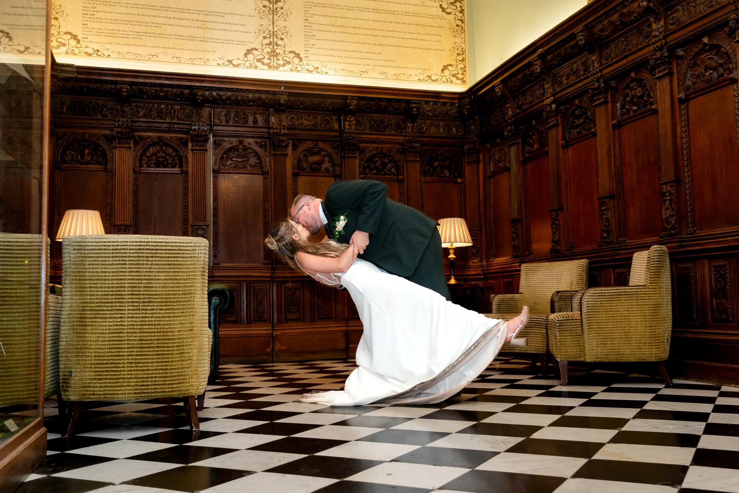 Editorial wedding portrait of a couple in a hall by Harry Phillips Photography